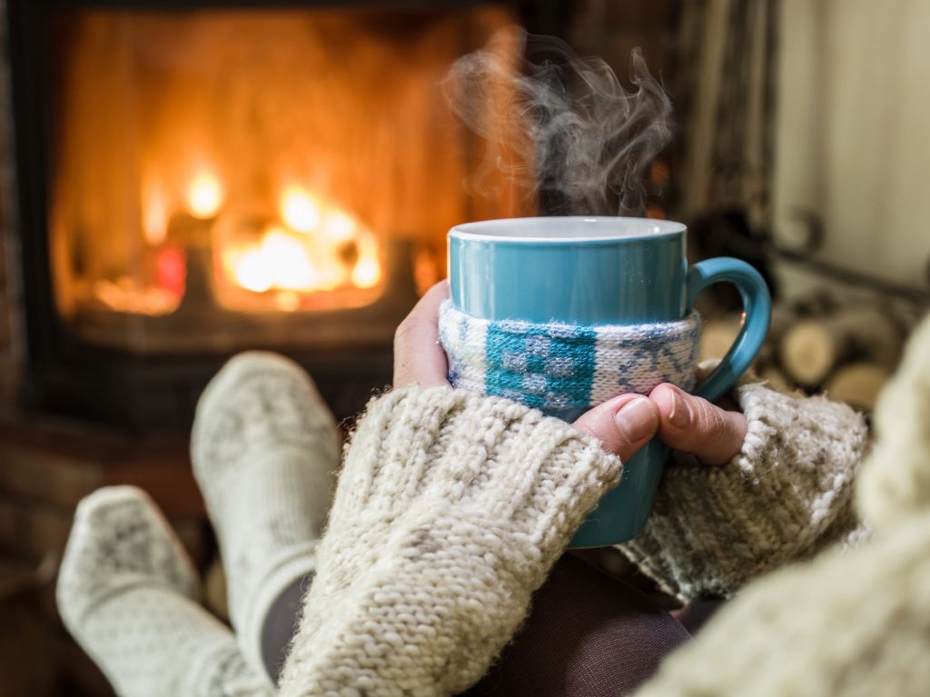 hygge - Warming and relaxing near fireplace.